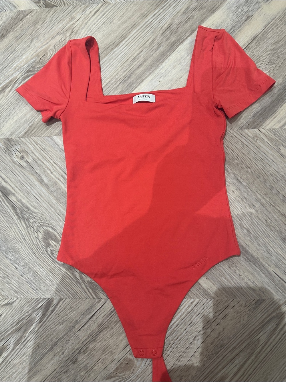 aritzia coral red bodysuit